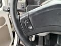 A close-up view of a steering wheel from a 2006 Sterling L7500 featuring an ON and OFF toggle button on the steering wheel's rim