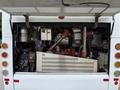 Engine compartment of a 2018 Grande West Vicinity bus showing various mechanical components and piping