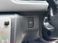 A close-up view of a control panel in a 2009 Toyota Hiace featuring a button labeled LIFT and gear shift options P R N D-3