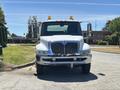 A 2008 International DuraStar truck with a shiny front grille and orange roof lights positioned head-on