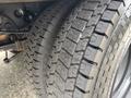 Close-up of the tires on a 2010 Ford F-550 Super Duty showing the tread pattern and sidewall details
