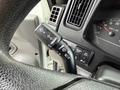 Close-up of the turn signal and wiper controls on the steering column of a 2022 International MV607 truck