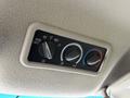 Climate control panel featuring three dials for temperature and fan speed with labeled settings for rear control and three fan speeds