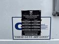 A 2011 Ford F-650 truck displaying an identification plate for Allied Spacecraft Corporation with various specifications and licensing information