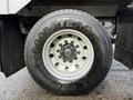 A close-up of a Goodyear tire mounted on a 2011 International WorkStar with a silver wheel and visible lug nuts
