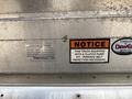 A silver metal plate with specifications and instructions for a clutch pump on a 2011 Workhorse W62 including serial numbers and safety notice labels
