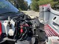 2007 GMC C4500 TopKick with an open hood revealing the engine and various components including hoses and wiring