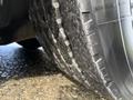 Close-up of a 2016 Grande West Vicinity tire showing worn tread and grooves on the surface