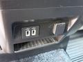 Close-up of the interior console of a 2019 Ford F-550 showing two USB ports and a small compartment