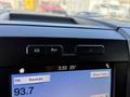 Interior dashboard controls of a 2019 Ford F-550 displaying buttons for hazard lights and traction control along with a touchscreen radio showing the time and temperature