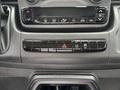 Dashboard controls of a 2023 RAM Promaster 3500 featuring climate control buttons and a hazard light switch