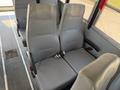 Two gray, padded bus seats in a row with seatbelts, designed for a 2009 International 3000 CE model, positioned facing forward inside the vehicle