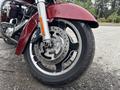 A close-up view of the front wheel and brake system of a 2009 Harley-Davidson Road King showcasing the disc brake and tire design