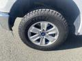 Close-up of a 2017 Ford F-150 wheel featuring a Goodyear tire with a shiny silver alloy rim