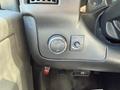 A close-up of the dashboard controls in a 2017 Chevrolet Express showing lighting and fog light switches