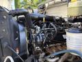 2017 Ford F-650 Super Duty engine with various components including hoses pipes and reservoirs visible