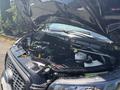 A Ford Transit T-350 engine bay view with the hood raised showing various engine components and coolant reservoir