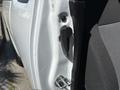 Close-up of the door latch and handle of a 2011 Chevrolet Colorado