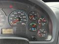 Dashboard of a 2006 International 4300 showing speedometer fuel gauge and various warning lights