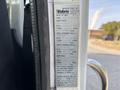 A 2011 Autocar Xpeditor with a manufacturing label displaying specifications including date of manufacture gross vehicle weight and tire details