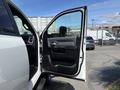 A 2021 RAM 5500 truck with its driver's side door open showing the interior features and door panel design