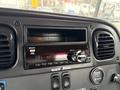 The interior dashboard of a 2021 Freightliner M2 106 featuring a radio unit with Bluetooth and various control buttons