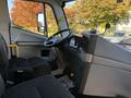 Interior view of a 2022 Lion Lion6 vehicle showcasing the driver's seat steering wheel and dashboard controls