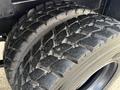 Close-up view of the tire on a 2015 Freightliner M2 showcasing rugged tread designed for traction and durability