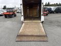 A 2016 Continental cargo trailer with a wooden floor and a ramp lowered at the rear for loading and unloading cargo