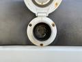 A fuel cap for a 2016 Mercedes-Benz Sprinter with a circular opening and a latch mechanism