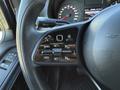 Close-up of the steering wheel control panel featuring buttons for cruise control settings and functions on a 2023 Mercedes-Benz Sprinter 2500