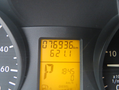 Dashboard display of a 2009 Dodge Sprinter Van showing odometer reading of 76936 km and trip distance of 621.1 km with digital time displayed as 18:45