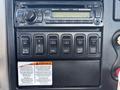 Dashboard of a 2013 International 7500 featuring controls for audio and various operational switches