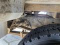 Close-up of the underside of a 2015 Ford F-550 showing the suspension components and tire detail
