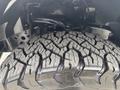 Close-up of a rugged tire tread on a 2017 Ford F-150 showcasing deep grooves and strong grip designed for off-road performance
