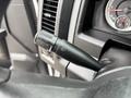 A close-up of a black windshield wiper control lever in a 2013 RAM 1500 showing various toggle functions