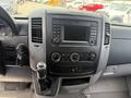 Interior dashboard of a 2016 Mercedes-Benz Sprinter featuring radio controls climate knobs and gear shift