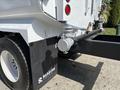 A 2016 Ford F-750 truck featuring a mounted tank and hose system labeled with the brand Reading on the side panel