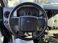 Interior view of a 2008 Ford F-550 showing the steering wheel dashboard gauges and controls