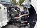 2025 Peterbilt 536 truck with the hood open displaying the engine and mechanical components including hoses and pipes