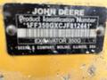 A metal identification plate displaying the JOHN DEERE logo and product details for a 2018 John Deere 350 excavator