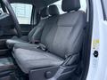Interior view of a 2023 Ford F-250 showing gray fabric front seats with adjustable settings and seatbelts