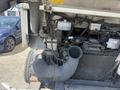 The image shows the engine compartment of a 2009 Workhorse W62 featuring the air intake, hoses, and various engine components visible