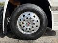 Close-up of a chrome wheel rim on a 2022 Lion Lion6 truck featuring black lug nuts and a Goodyear Fuel Max RT tire with visible tread patterns