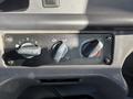 Close-up of the climate control knobs in a 2005 Freightliner M2 106 with settings for fan speed and temperature adjustment