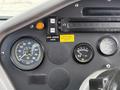 Dashboard of a 2012 Global M4 with multiple gauges indicating speed, voltage and other readings along with control buttons
