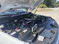 A 2023 Ford F-350 Super Duty engine compartment showcasing the engine components and layout