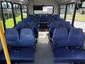 Interior of a 2020 Chevrolet Express with blue upholstered seats arranged in rows