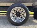 A close-up view of a wheel featuring a silver rim and a black tire with the label Continental EcoPlus HS3 and size specifications 295/60 R 22.5