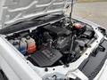 A 2011 Chevrolet Colorado engine with various components including the air intake system battery and coolant reservoir visible under the hood